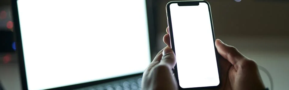 Using gadgets. Close up shot of blank white screen of smarthone. Man sitting in 스톡 사진