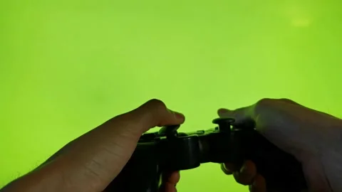 Using a game controller. Playing video games concept. Changing color screen. Video stock 170525926