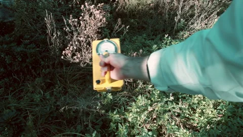 Using geiger counter outside 2 Stock Footage 142725580