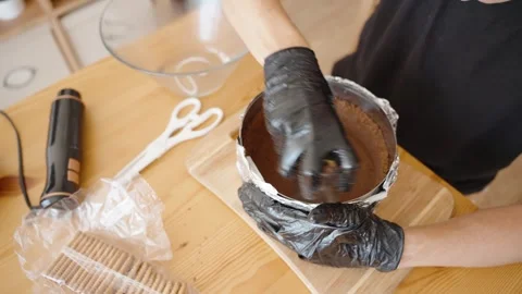 Using a Glass to Compact the Cookie Crumb Mixture, Creating a Solid Base. The Stock Footage 280081830