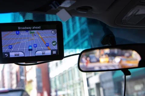 Using a global positioning system device inside car to navigate the traffic m Stock Photos