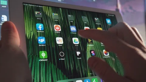 Using the google drive app and looking at documents on a tablet. Stock Footage 125184413