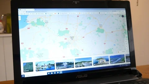 Using a Google Maps of Paris Streets on Laptop to fined a place Stock Footage 120687007