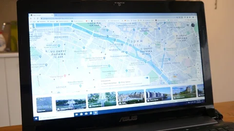 Using a Google Maps of Paris Streets on Laptop to fined a place Stock Footage 120687062