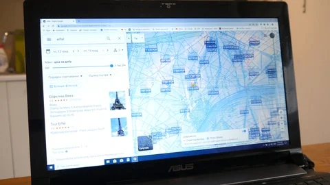 Using a Google Maps of Paris Streets on Laptop to fined a place Stock Footage 120687087