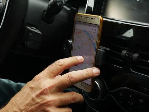Using a GPS in the car with right hand Stock Photos