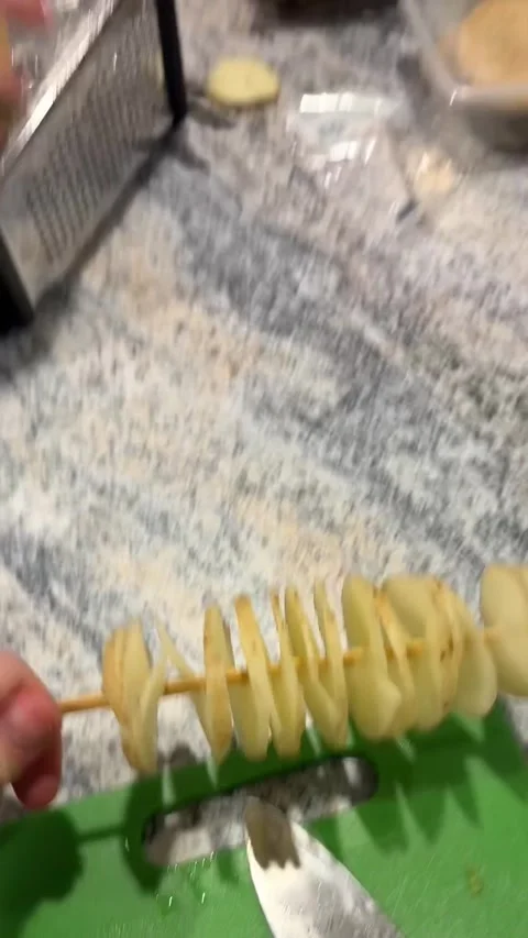 Using a Grater to Make Spiral Potatoes, Melbourne, Victoria, Australia - 01 May  Stock Footage 309147695