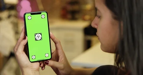 Using a green screen phone in an apartment kitchen Stock Footage 96672802