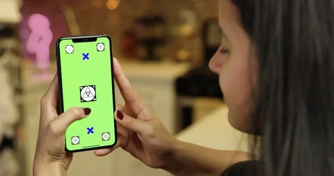 Using a green screen phone in an apartment kitchen Stock Footage 96674849