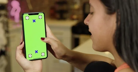 Using a green screen phone in an apartment kitchen Stock Footage 96674904