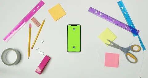 Using green screen phone on a arts and crafts white table Stock Footage 97481154