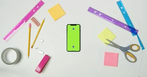 Using green screen phone on a arts and crafts white table Stock Footage 97481225