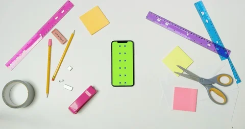 Using green screen phone on a arts and crafts white table Stock Footage 97481825