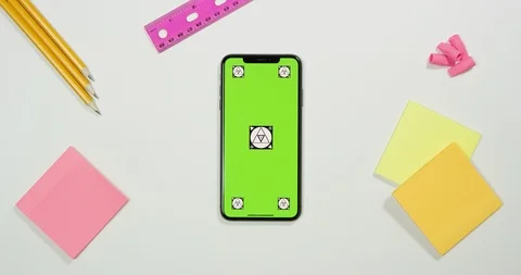 Using green screen phone on a arts and crafts white table Stock Footage 97483146