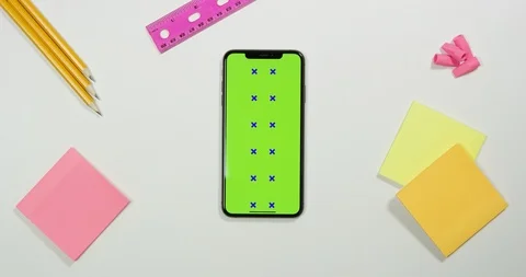Using green screen phone on a arts and crafts white table Stock Footage 97483592