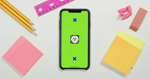Using green screen phone on a arts and crafts white table Stock Footage 97484914