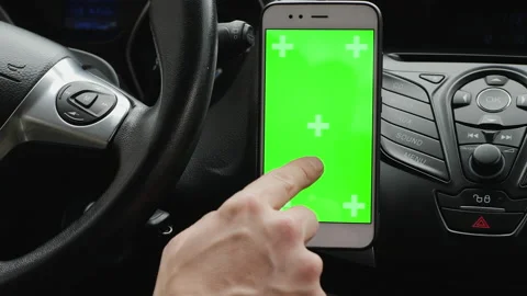 Using a green screen smartphone on the car dashboard Stock Footage 132878501