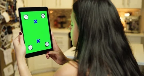 Using a green screen tablet in an apartment kitchen Stock Footage 96669945