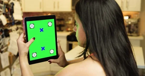 Using a green screen tablet in an apartment kitchen Stock Footage 96672921