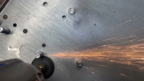 Using a Grider to cut metal overhead POV shot Stock Footage 227142596