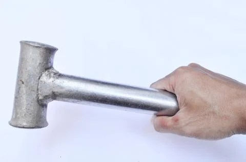 Using a hammer for work needs to be careful for your safety Stock Photos