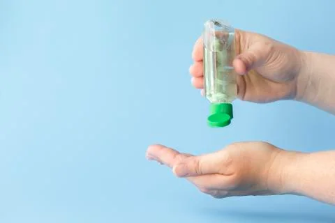 Using hand sanitizer Stock Photos