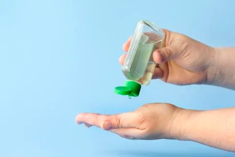 Using hand sanitizer Stock Photos