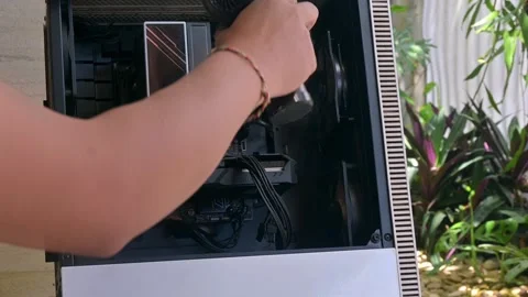 Using Handheld Cordless Air Duster to Clean Computer Chassis Interior Stock Footage 335202566