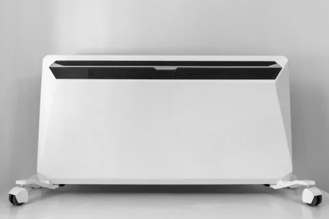 Using heater at home in winter. Heating season. Modern Electric Heater with c Stock Photos