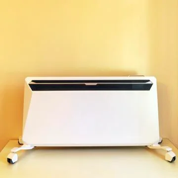 Using heater at home in winter. Heating season. Modern Electric Heater with c Stock Photos