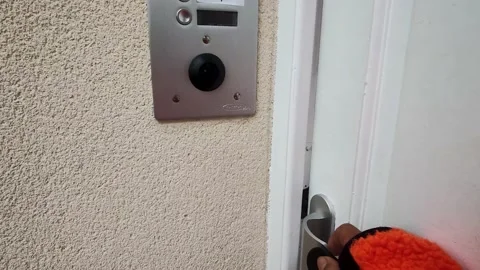 Using her House Key Card. A Girl Enters a House Using an Intercom. Stock Footage 223666503