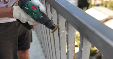 Using high speed rotary multitool to clean rusty pipe Stock Footage 260597455