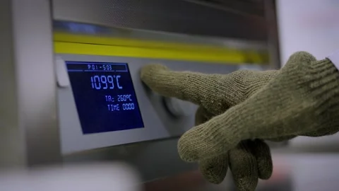 Using a hight temperature oven set to 1099 degrees Stock Footage 300709623
