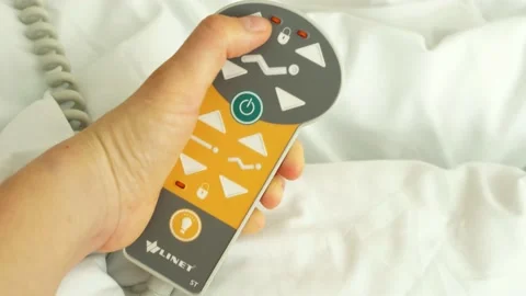 Using hospital bed control panel pilot remote controller Stock Footage 130795116
