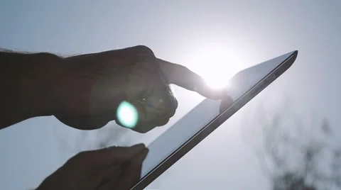 Using IPad Computer On Background Sky Stock Footage 49413682