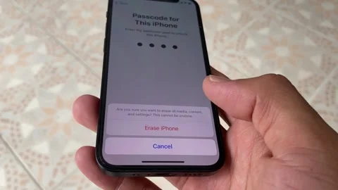 Using iphone 12 mini tapping gesture on "Erase This iPhone" screen Stock Footage 243092831