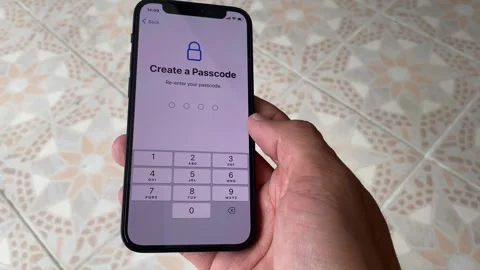 Using iphone 12 mini tapping gesture on "Create a Passcode" menu Video stock 243092836