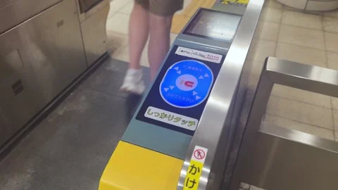 Using iPhone IC Card at Tokyo Subway Gate Stock Footage 336558221