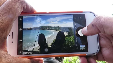 Using iphone taking photo of Karitane Beach  Stock Footage 120628634