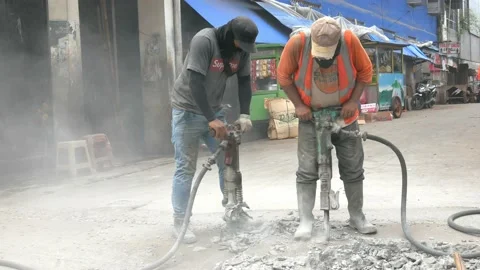 Using Jack Hammer On Street Stock Footage 168918612