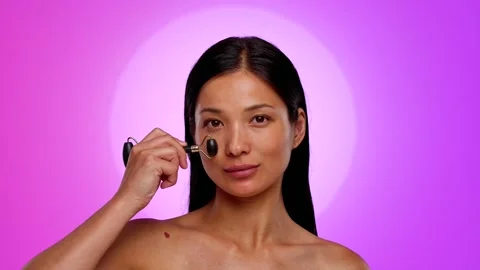 Using Jade Roller for Relaxing Facial Massage Beauty Care Stock Footage 314166626