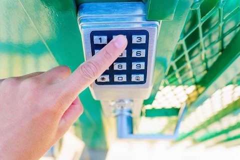 Using a keyless keypad lock outdoors Stock Photos