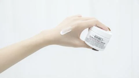 Using Kiehl's moisturizer Stock Photos