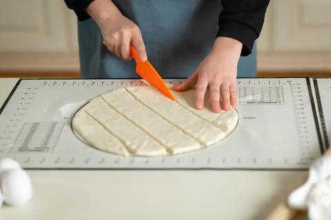 Using the kitchen silicone baking mat with markings and tips in the process of Stock Photos