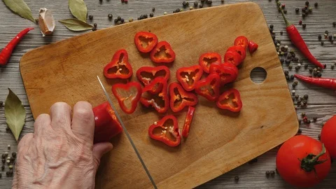 Using Knife To Cutting Ramiro Red Hot Pepper On Cutting Wooden Board. Top View.  스톡 동영상 128626328