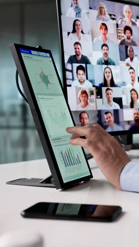 Using KPI Dashboard On Secondary Screen Stock Footage 329296284