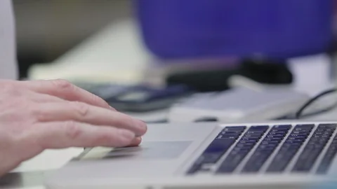 Using laptop computer touchpad and keyboard Stock Footage 86904778
