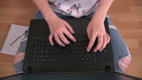 Using Laptop on Floor Cross-Legged Stock Footage 138163868
