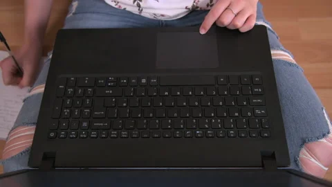Using Laptop on Floor Crossed Legs Stock Footage 138231382