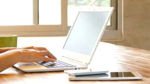 Using laptop at home Stock Footage 102985011